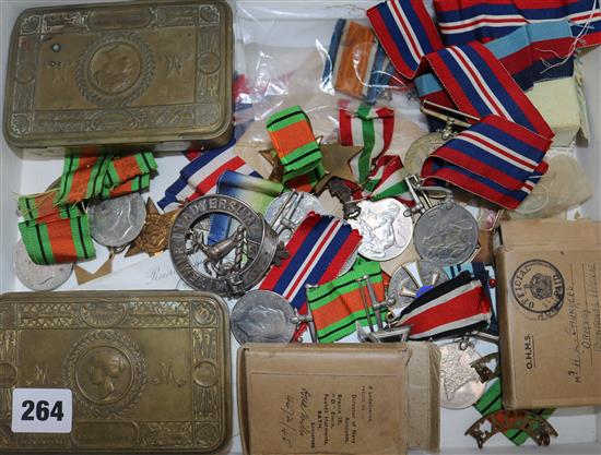 A collection of Military tobacco tins, medals, etc.